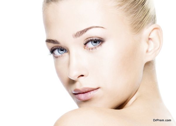 Portrait of beautiful young blond woman with clean face.  High key shot.