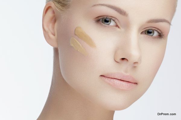 close-up portrait of young beautiful woman with cosmetic foundation