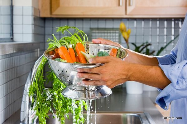 Man Rinsing Carrots