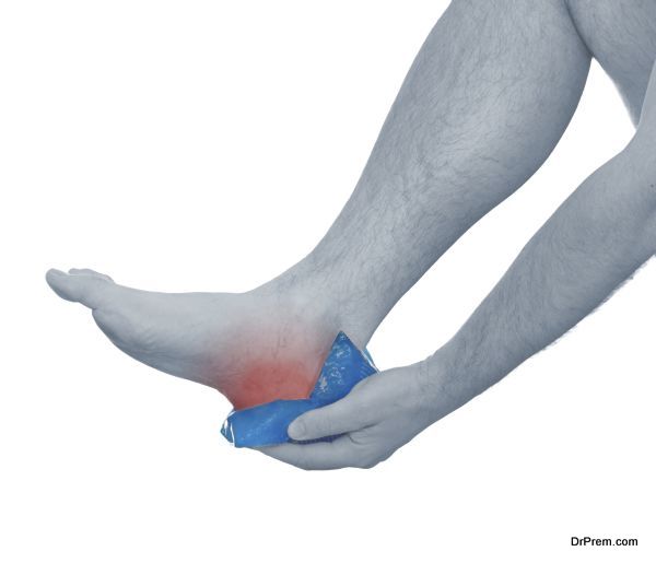 Holding ice gel pack on knee.Medical concept photo. Isolation on a white background.