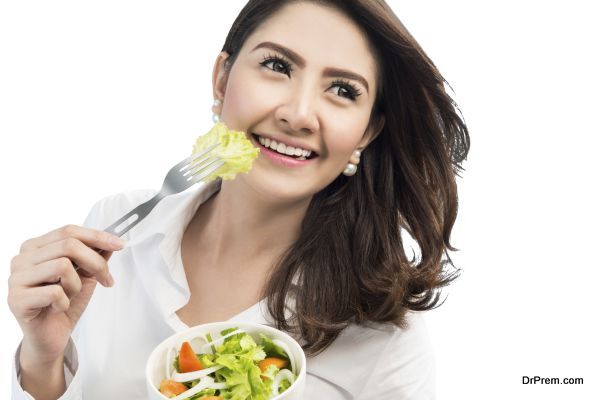 Woman eating salad