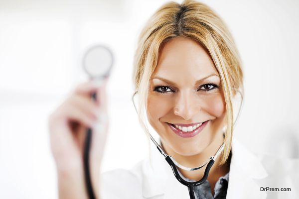 Portrait of successful doctor showing her stethoscope.