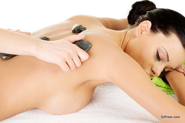 Attractive woman lying on bed. Spa concept.