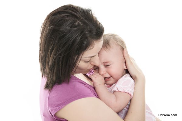 Mother trying to calm her crying baby