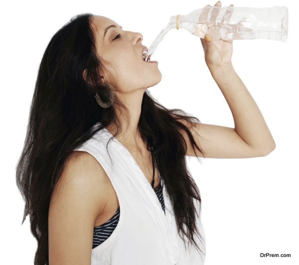 Portrait of a woman drinking water.