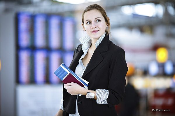 Pretty young female passenger at the airport (shallow DOF; color toned image)