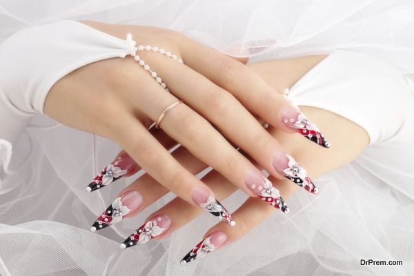 Hands of the bride with beautiful nails.