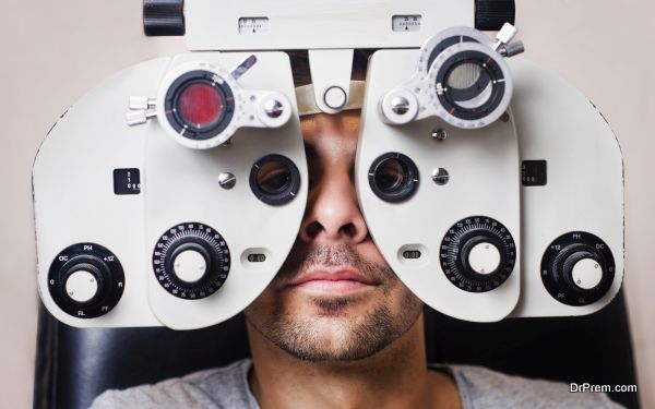 Man in optometrist phoropter redy for eye exam calibration