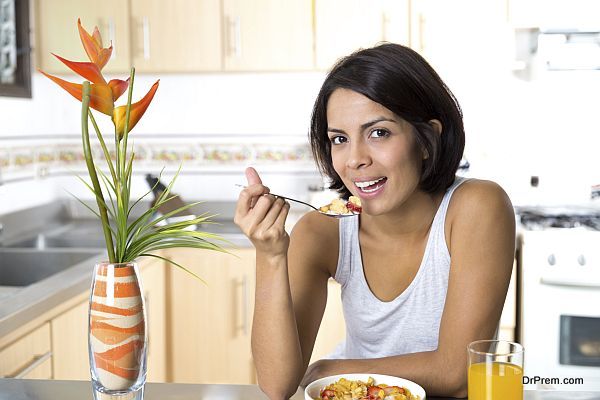 Attractive woman having breakfast