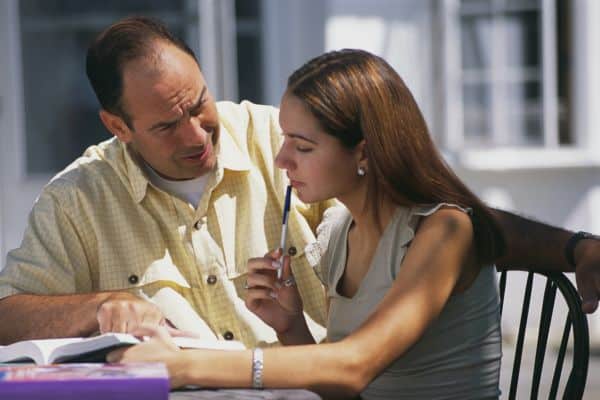 Father Helping Daughter with Homework