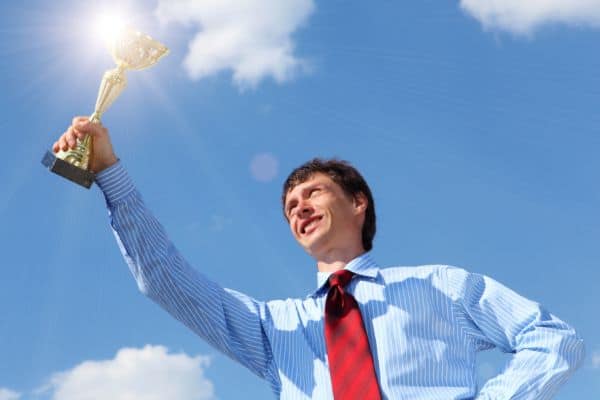 young businessman  with a golden cup