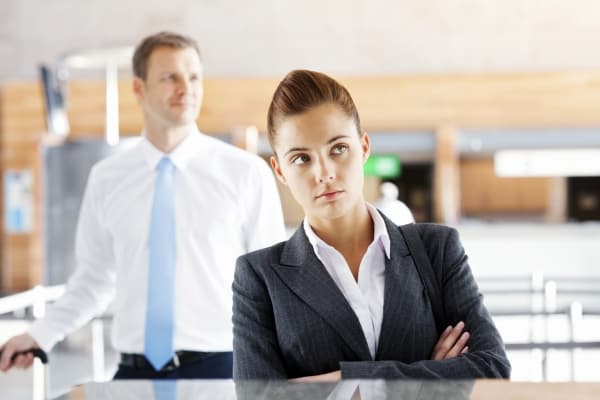 Unhappy Business Woman Waiting At Check-In Desk