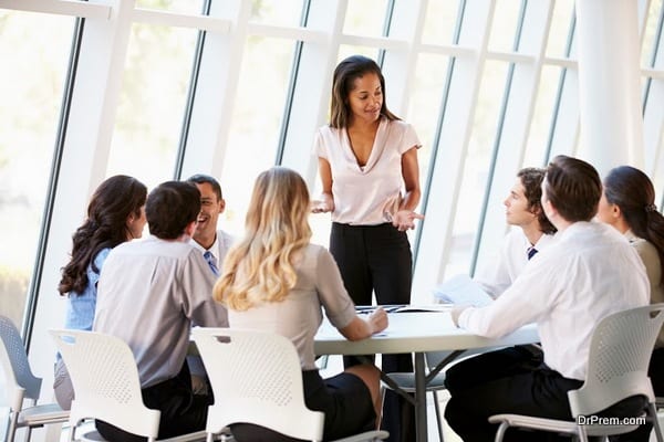 Business People Having Board Meeting In Modern Office