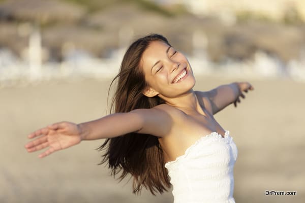 Carefree beach woman happy