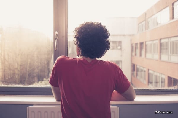 Young man looking out the window