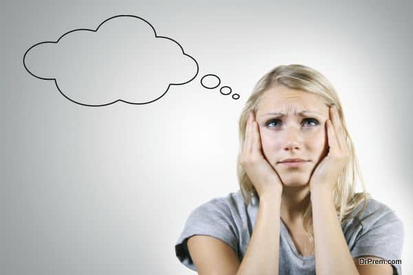 pensive woman with blank thought bubble on gray background