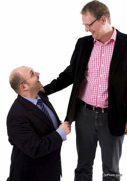 Two businessman standing next to eachother on white background