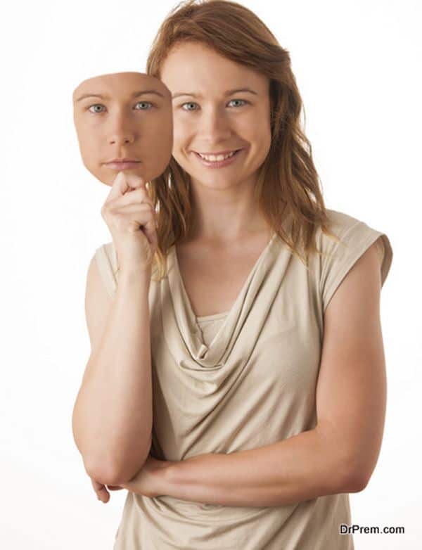 Woman hiding under the happy mask.