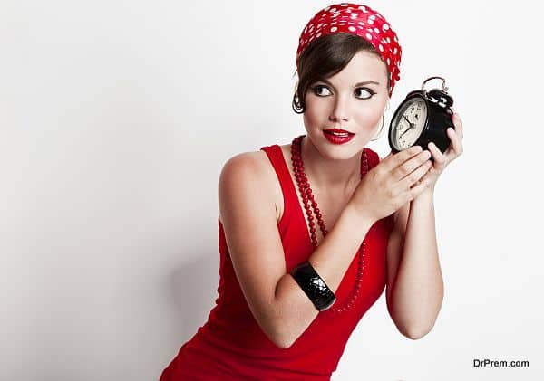 Girl holding a clock