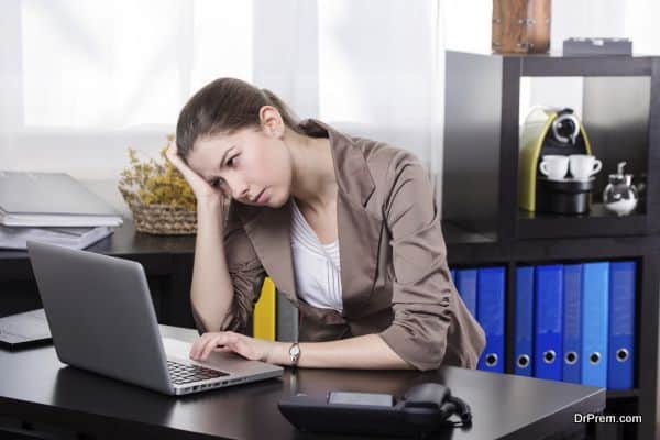 Elegant stressful business woman work on the notebook in the office.