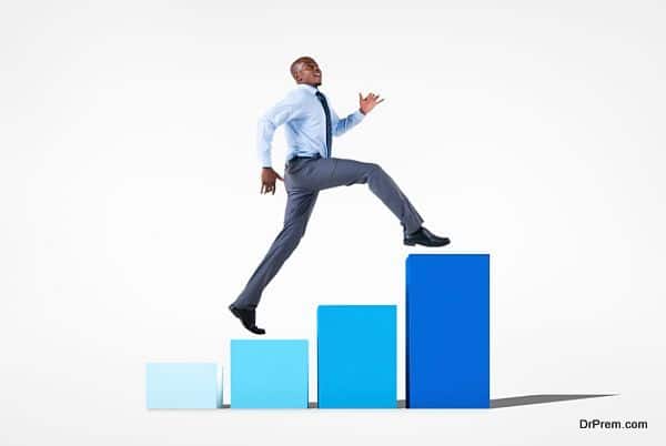 Businessman Jumping on a Developing Graph