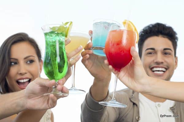 Group Of Happy Smiling Friends Celebrating Toasting With Glasses Of Juice