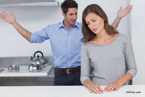 Man gesturing to wife during a dispute