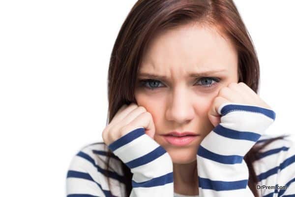 Worried young brunette posing