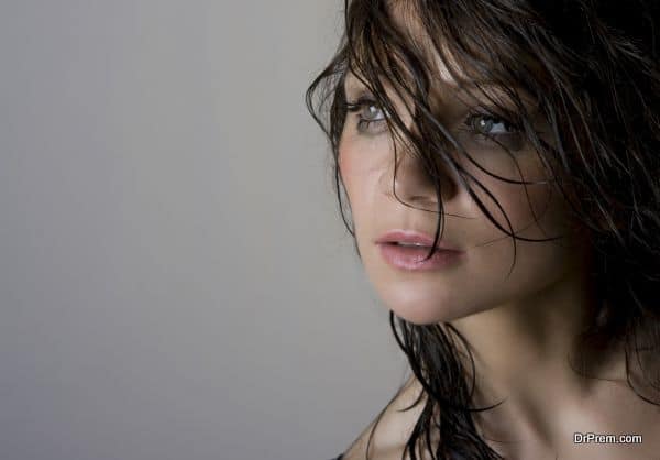 Close-up portrait of beautiful wet brunette