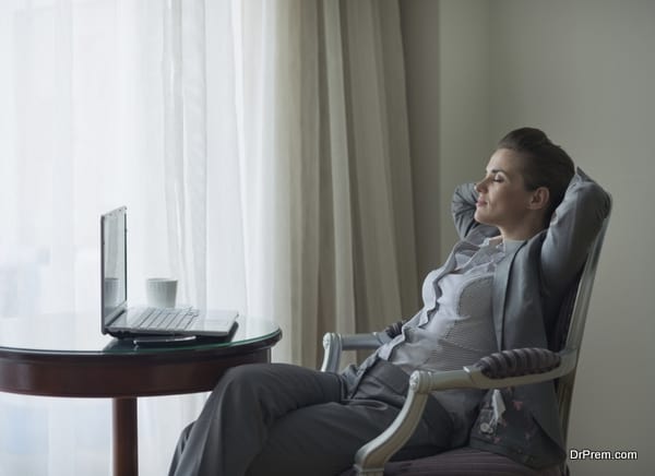 Relaxed business woman in hotel room