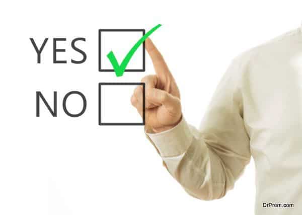 businessman hand and checkbox with green mark checking yes