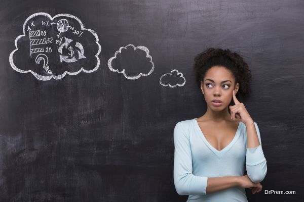 Thoughtful afro-american woman trying to solve a problem on chal