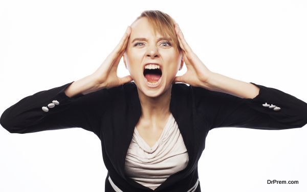 Stress and fatigue: angry screaming businesswoman. Isolated on white.