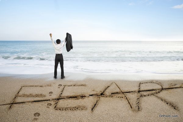 Businessman cheering with fear word deleted line written on sand beach background