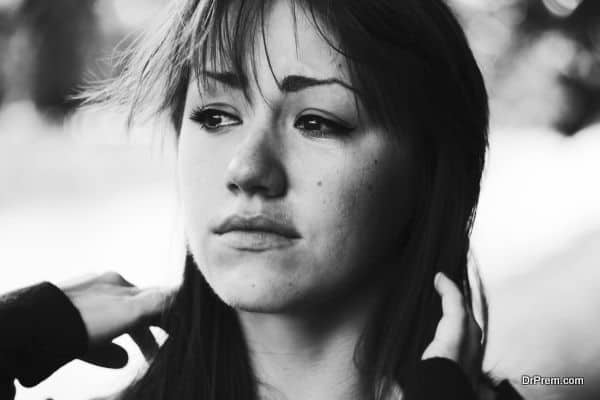 Puffy eyes. Emotional portrait of beautiful brunette. Depression, sadness, loneliness. Black and white photo