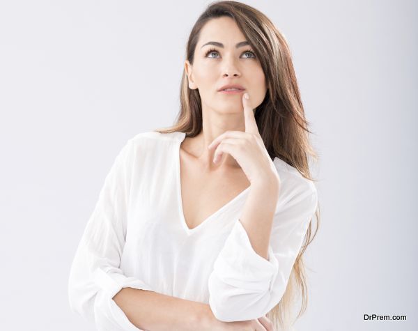 Portrait of pensive young woman looking up