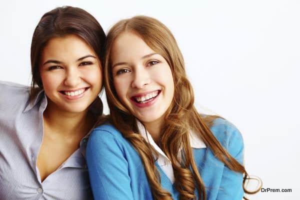 Portrait of Joyful Girls looking at camera on white background