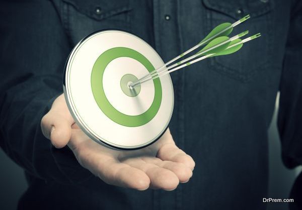 Man Holding Green Target - Marketing Solutions Concept