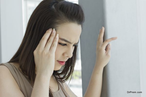 woman with headache, migraine, stress, insomnia, hangover in casual dress