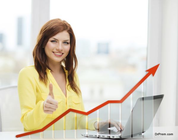people, technology, statistic sand business concept - smiling woman with laptop computer and growth chart showing thumbs up at home