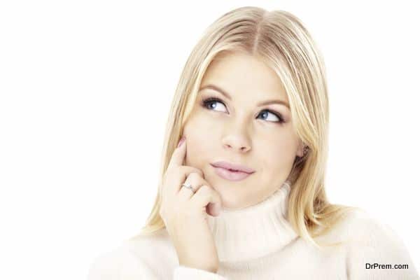 Portrait of the thoughtful blonde isolated on a white background