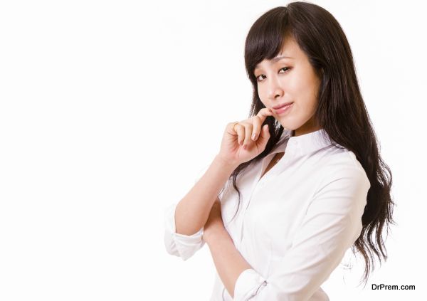 Chinese woman in white shirt with sly smile