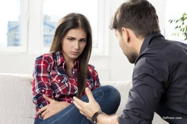 quarreled couple in their living room