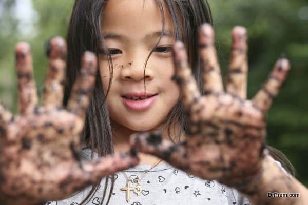 close up of child  showing two dirty hands