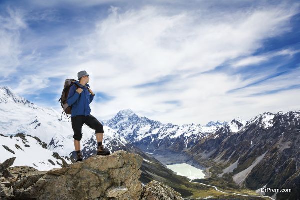 hiker with backpack and mountain panorama