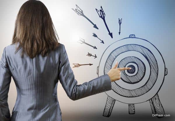Rear view of businesswoman pointing at drawn target