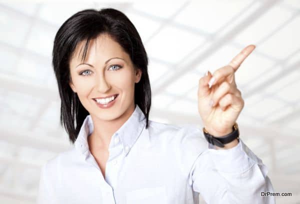 Portrait of beautiful woman smiling and pointing right direction