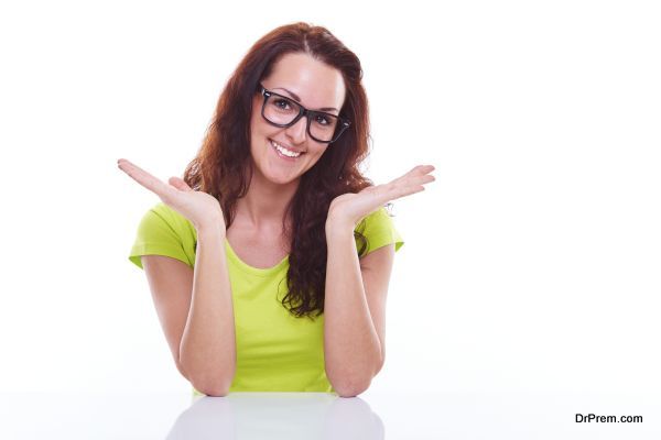 Smiling young woman on a white background