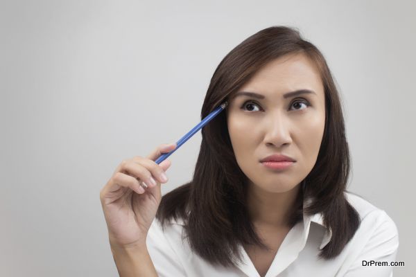 Young businesswoman thinking about an idea