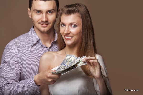 Fashion beautiful couple in love holding money